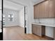 Open living space with a butler's pantry and gleaming hardwood floors at 3406 W Alline Ave, Tampa, FL 33611