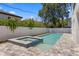 Beautiful backyard featuring a modern pool with an attached spa and a white privacy fence at 3406 W Alline Ave, Tampa, FL 33611