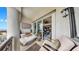 Relaxing balcony with cushioned seating and views to the inside through sliding glass doors at 345 Bayshore Blvd # Gp10, Tampa, FL 33606