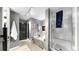 Elegant bathroom featuring a walk-in shower, gray marble accents, a soaking tub and a door to close off the area at 345 Bayshore Blvd # Gp10, Tampa, FL 33606