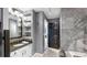 Bathroom featuring a vanity, granite counters, custom shelving, and a luxurious bathtub with stylish gray accent wall at 345 Bayshore Blvd # Gp10, Tampa, FL 33606