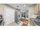 Kitchen featuring stainless steel appliances, light wooden cabinets, and a tile backsplash at 345 Bayshore Blvd # Gp10, Tampa, FL 33606