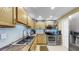 Kitchen featuring stainless steel appliances, light wooden cabinets and countertops, and a tile backsplash at 345 Bayshore Blvd # Gp10, Tampa, FL 33606