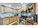 Modern kitchen featuring stainless steel appliances, light wooden cabinets and countertops, and a tile backsplash at 345 Bayshore Blvd # Gp10, Tampa, FL 33606