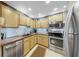 Bright kitchen features modern stainless steel appliances, light wooden cabinets, and warm countertops at 345 Bayshore Blvd # Gp10, Tampa, FL 33606