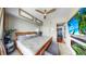 A lovely main bedroom features a large wooden bed, light-toned walls, and tropical-themed decor at 345 Bayshore Blvd # Gp10, Tampa, FL 33606