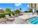 Relaxing pool deck with several lounge chairs near a church and a high-rise building at 345 Bayshore Blvd # Gp10, Tampa, FL 33606