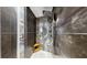 Modern shower with sleek tile and geometric floor, offering a luxurious bathing experience at 345 Bayshore Blvd # Gp10, Tampa, FL 33606