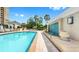 Bright swimming pool with a side water feature and covered area with seating nearby at 345 Bayshore Blvd # Gp10, Tampa, FL 33606