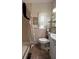 Well-lit bathroom with shower and tile flooring, designed for functionality and comfort at 3829 Chah Dr, Zephyrhills, FL 33541