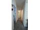 Hallway that provides access to the various rooms in the house at 3829 Chah Dr, Zephyrhills, FL 33541