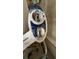 Close-up of a toilet fixture with a modern bidet attachment at 3829 Chah Dr, Zephyrhills, FL 33541