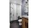 Beautiful bathroom with modern fixtures, herringbone tile floor, and a glass-enclosed shower at 389 Bayview Ne Dr, St Petersburg, FL 33704