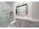 Elegant bathroom featuring marble shower, vanity with quartz countertop, and modern fixtures at 389 Bayview Ne Dr, St Petersburg, FL 33704