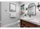 Modern bathroom features unique floor tile, marble countertop, and stylish black accents at 389 Bayview Ne Dr, St Petersburg, FL 33704