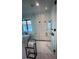 A luxurious bathroom with decorative tile shower, glass door, and modern fixtures at 389 Bayview Ne Dr, St Petersburg, FL 33704