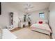 Bright bedroom with white accents, a ceiling fan, and natural light at 389 Bayview Ne Dr, St Petersburg, FL 33704