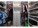 Organized walk-in closet with custom shelving and storage solutions for clothing and accessories at 389 Bayview Ne Dr, St Petersburg, FL 33704