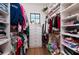 Walk-in closet with built-in shelving, drawers, and organized storage for clothes at 389 Bayview Ne Dr, St Petersburg, FL 33704