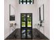 Elegant entryway with high ceilings, modern art, and marble floors for a grand welcome at 389 Bayview Ne Dr, St Petersburg, FL 33704