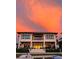 Stunning two-story waterfront home featuring multiple balconies perfect for enjoying colorful sunsets at 389 Bayview Ne Dr, St Petersburg, FL 33704