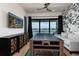 Bright game room featuring ping pong table, lake views, and quirky decor at 389 Bayview Ne Dr, St Petersburg, FL 33704