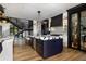 Stylish kitchen with hardwood floors, large island, wine storage, and stainless steel appliances at 389 Bayview Ne Dr, St Petersburg, FL 33704
