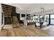 Open-concept living space with modern furnishings and access to outdoor views at 389 Bayview Ne Dr, St Petersburg, FL 33704