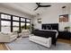 Beautiful primary bedroom featuring scenic water views, an elegant rug, and modern decor at 389 Bayview Ne Dr, St Petersburg, FL 33704