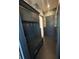 Mudroom with custom built-ins, storage, and seating, accented by black and white wallpaper at 389 Bayview Ne Dr, St Petersburg, FL 33704