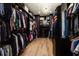 Expansive walk-in closet with custom shelving and a modern chandelier at 389 Bayview Ne Dr, St Petersburg, FL 33704