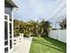 Backyard with outdoor kitchen, privacy fence and well manicured landscaping at 428 45Th N Ave, St Petersburg, FL 33703