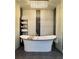 Luxurious bathroom features a free-standing tub, modern fixtures, and a decorative chandelier at 428 45Th N Ave, St Petersburg, FL 33703