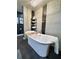 Elegant bathroom features a free-standing tub, stylish fixtures, and a decorative chandelier at 428 45Th N Ave, St Petersburg, FL 33703