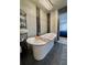 Luxurious bathroom features a free-standing tub, modern fixtures, and tile flooring at 428 45Th N Ave, St Petersburg, FL 33703