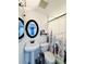 Functional bathroom with a pedestal sink, oval mirror, toilet, and shower with a decorative floral curtain for privacy at 428 45Th N Ave, St Petersburg, FL 33703