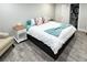 Spacious bedroom with hardwood floors and a comfortable bed and colorful throw pillows, creating a serene and inviting atmosphere at 428 45Th N Ave, St Petersburg, FL 33703