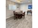 Cozy dining room featuring new hardwood flooring, a modern light fixture, and a wet bar at 428 45Th N Ave, St Petersburg, FL 33703