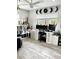 Bright home office featuring modern white furniture, wood floors, decorative shelves and a large window for natural light at 428 45Th N Ave, St Petersburg, FL 33703