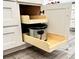 Convenient kitchen cabinet with pull-out drawers for easy organization at 428 45Th N Ave, St Petersburg, FL 33703
