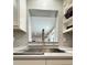 Modern kitchen sink with stainless steel faucet and white subway tile backsplash at 428 45Th N Ave, St Petersburg, FL 33703