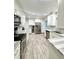 Modern kitchen with stainless steel appliances, new cabinets, and sleek countertops at 428 45Th N Ave, St Petersburg, FL 33703