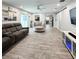 Open-concept living room with wood floors, stylish furnishings, and a view to the kitchen at 428 45Th N Ave, St Petersburg, FL 33703