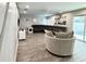 Spacious living room with a large sectional sofa, modern decor, and ample natural light at 428 45Th N Ave, St Petersburg, FL 33703