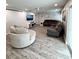 Bright, open living room with modern decor, neutral colors, and wood-look flooring at 428 45Th N Ave, St Petersburg, FL 33703
