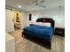 Spacious main bedroom with ceiling fan, ensuite bath, barn door and wood-look tile flooring at 428 45Th N Ave, St Petersburg, FL 33703