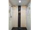 Luxurious dual shower heads with a black and white theme and river rock flooring at 428 45Th N Ave, St Petersburg, FL 33703