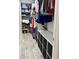 Well-organized walk-in closet featuring custom shelving, storage compartments, and tile flooring at 428 45Th N Ave, St Petersburg, FL 33703