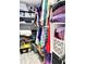 Organized walk-in closet with ample shelving, storage solutions, and tile flooring at 428 45Th N Ave, St Petersburg, FL 33703