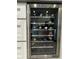 Modern wine cooler showcasing multiple wine bottles and stainless steel trim at 428 45Th N Ave, St Petersburg, FL 33703